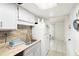 Kitchen with white cabinets and granite countertops at 200 Maitland Ave # 174, Altamonte Springs, FL 32701
