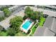 Community pool with lounge chairs and umbrellas at 200 Maitland Ave # 174, Altamonte Springs, FL 32701