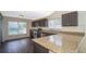 Galley kitchen with granite countertops and stainless steel appliances at 7628 Eldorado Pl, Orlando, FL 32818