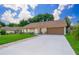 Single-story house with attached garage and well-manicured lawn at 7628 Eldorado Pl, Orlando, FL 32818