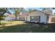 White home with gray accents and attached garage at 1030 Gregory Dr, Maitland, FL 32751