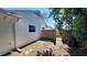 A view of the backyard with a wooden fence and side yard at 1030 Gregory Dr, Maitland, FL 32751