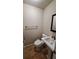Clean bathroom with toilet, pedestal sink and mirror at 1030 Gregory Dr, Maitland, FL 32751