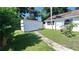 White storage shed in the backyard, near a fence at 1030 Gregory Dr, Maitland, FL 32751