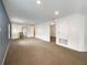 Large main bedroom with carpet flooring and access to additional rooms at 7574 Marker Ave, Kissimmee, FL 34747