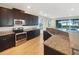 Spacious kitchen boasts stainless steel appliances and ample cabinetry at 7574 Marker Ave, Kissimmee, FL 34747