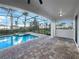 Relaxing screened pool and spa with brick pavers at 7574 Marker Ave, Kissimmee, FL 34747