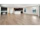Open kitchen with island, stainless steel appliances, and dark wood cabinets at 7574 Marker Ave, Kissimmee, FL 34747