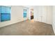 Spacious bedroom with carpet and large windows at 7574 Marker Ave, Kissimmee, FL 34747