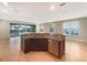 Kitchen with large island, granite counters, and stainless steel appliances at 7574 Marker Ave, Kissimmee, FL 34747