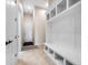 Entryway with built-in bench seating and storage at 2490 Zuni Rd, St Cloud, FL 34771