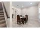 Formal dining room adjacent to a staircase, featuring a large wooden table at 2490 Zuni Rd, Saint Cloud, FL 34771