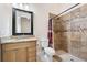 Bathroom with a shower, toilet, vanity with granite countertop at 2490 Zuni Rd, St Cloud, FL 34771