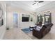 Living area features a built-in entertainment center and access to a patio at 2490 Zuni Rd, St Cloud, FL 34771