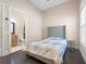 Bedroom with a gray upholstered headboard and en-suite bathroom at 2490 Zuni Rd, St Cloud, FL 34771