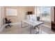 Bright home office with a large desk and two computer monitors at 2490 Zuni Rd, St Cloud, FL 34771