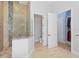 Spa-like bathroom with a walk-in shower and separate toilet area at 2490 Zuni Rd, St Cloud, FL 34771