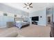 Bright Primary bedroom with a king-size bed and large TV at 2490 Zuni Rd, St Cloud, FL 34771