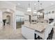 Spacious kitchen with large island, white cabinets, and stainless steel appliances at 2490 Zuni Rd, St Cloud, FL 34771