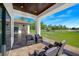 Outdoor patio with seating area and view of the backyard at 2490 Zuni Rd, St Cloud, FL 34771