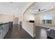 Spacious loft area with dark hardwood floors and a large window at 2490 Zuni Rd, St Cloud, FL 34771