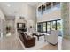 Open concept living area with a wet bar and sliding doors to the outside at 2490 Zuni Rd, St Cloud, FL 34771