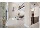 Home bar with granite countertop and glass shelving at 2490 Zuni Rd, St Cloud, FL 34771