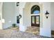 Elegant entryway with double doors and stone flooring at 2490 Zuni Rd, St Cloud, FL 34771