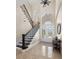 Grand entryway with a sweeping staircase and high ceilings at 2490 Zuni Rd, St Cloud, FL 34771