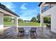 Relaxing back patio with stone tile flooring and a view of the open space at 2490 Zuni Rd, St Cloud, FL 34771