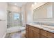 Clean bathroom with shower, vanity, and granite countertop at 2490 Zuni Rd, St Cloud, FL 34771