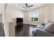 Loft with dark hardwood floors, ceiling fan and a gray couch at 2490 Zuni Rd, St Cloud, FL 34771