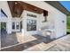 Outdoor kitchen with built-in grill and stone tile flooring at 2490 Zuni Rd, St Cloud, FL 34771