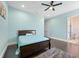 Serene bedroom with light-blue walls and a ceiling fan at 2490 Zuni Rd, St Cloud, FL 34771