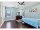 Bright bedroom with a window seat and dark hardwood floors at 2490 Zuni Rd, St Cloud, FL 34771