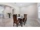 Elegant dining room with a large wooden table and six chairs at 2490 Zuni Rd, Saint Cloud, FL 34771