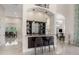 Wet bar with granite countertop and seating for two at 2490 Zuni Rd, St Cloud, FL 34771