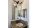 Bathroom boasts granite vanity and framed mirror at 2211 Rickover Pl, Winter Garden, FL 34787