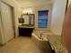 Bathroom features a corner soaking tub and granite vanity at 2211 Rickover Pl, Winter Garden, FL 34787