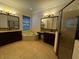 Bathroom boasts a large soaking tub, double vanity, and walk-in shower at 2211 Rickover Pl, Winter Garden, FL 34787