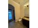 Bathroom with a granite vanity and shower access at 2211 Rickover Pl, Winter Garden, FL 34787
