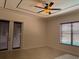 Bright bedroom with ceiling fan and double doors at 2211 Rickover Pl, Winter Garden, FL 34787