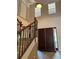 Grand two-story entryway with a curved staircase and dark wood doors at 2211 Rickover Pl, Winter Garden, FL 34787