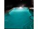 Luminous pool and spa at night at 2211 Rickover Pl, Winter Garden, FL 34787