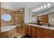 Elegant bathroom with double vanity and large shower at 480 Lake Kathryn Cir, Casselberry, FL 32707