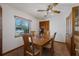 Bright dining room with wood table and built-in hutch at 480 Lake Kathryn Cir, Casselberry, FL 32707