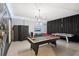 Fun game room with a pool table, air hockey table, and foosball table at 1431 Wexford Way, Davenport, FL 33896