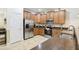 Well-equipped kitchen boasting stainless steel appliances and granite countertops at 1431 Wexford Way, Davenport, FL 33896