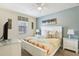 King-size bed, nightstands, and a large window in a well-lit bedroom at 1431 Wexford Way, Davenport, FL 33896