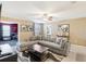 Comfortable living room featuring a large sectional sofa and a flat-screen TV at 1431 Wexford Way, Davenport, FL 33896